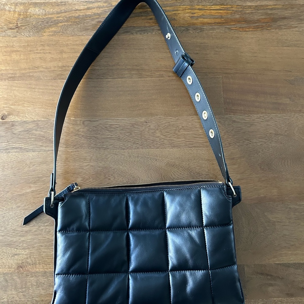 Black leather All Saints bag.  Can be worn as a shoulder bag or crossbody.